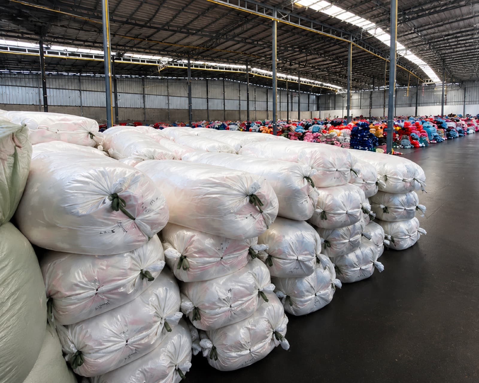 Bulk bedding bales stacked and ready for mixed loading
